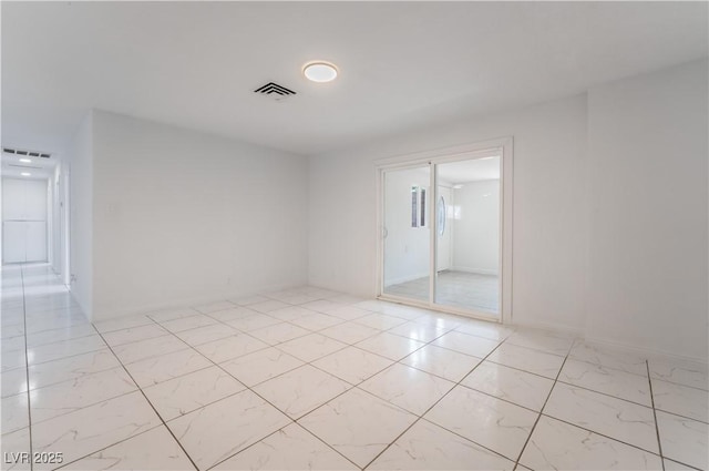 5317 Lytton Ave, Las Vegas, NV 89146 - unfurnished room featuring light marble finish floors