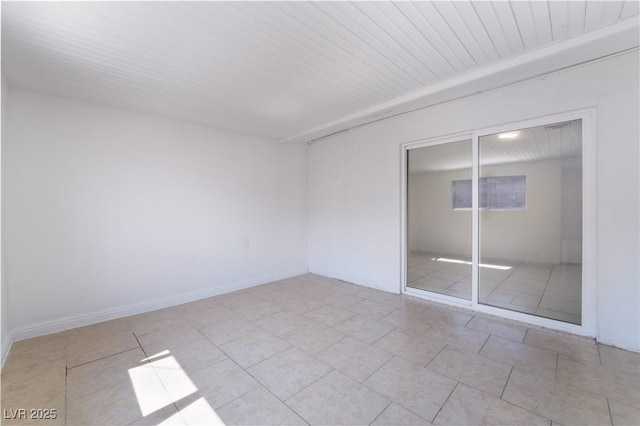 5317 Lytton Ave, Las Vegas, NV 89146 - unfurnished bedroom featuring a closet, light tile patterned floors, and wood ceiling