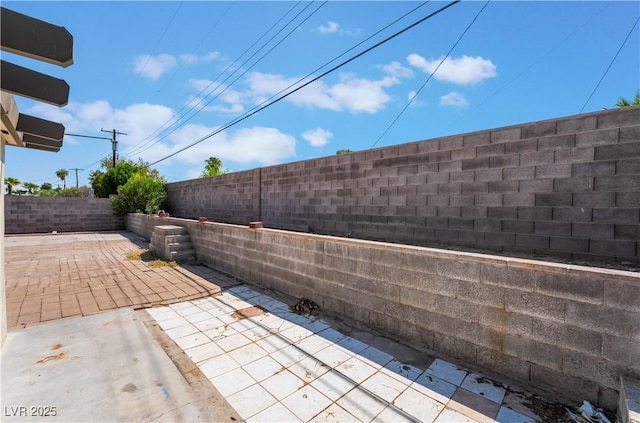 5317 Lytton Ave, Las Vegas, NV 89146 - fenced backyard with a patio