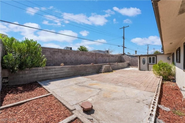 5317 Lytton Ave, Las Vegas, NV 89146 - fenced backyard with a patio area