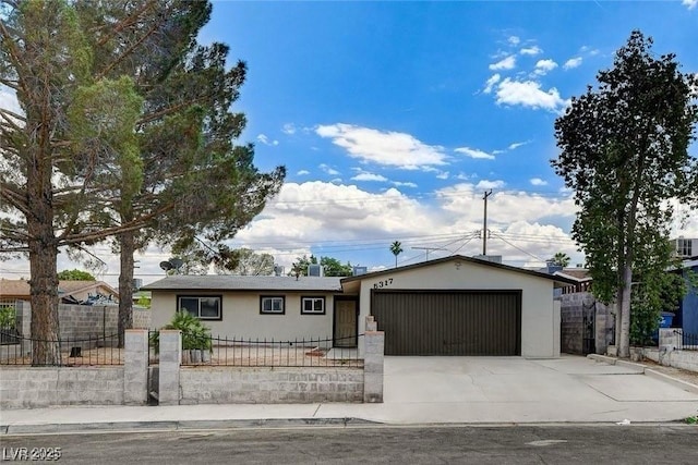 5317 Lytton Ave, Las Vegas, NV 89146 - ranch-style house featuring stucco siding, a fenced front yard, driveway, and an attached garage
