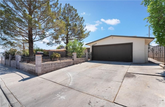 5317 Lytton Ave, Las Vegas, NV 89146 - single story home with stucco siding, a fenced front yard, a gate, and a detached garage