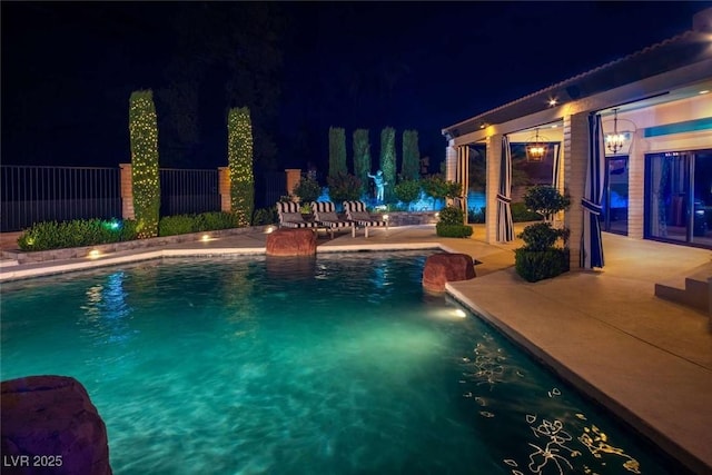2030 Mohigan Way, Las Vegas, NV 89169 - pool at night with a patio