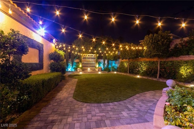 2030 Mohigan Way, Las Vegas, NV 89169 - yard at twilight with a fenced backyard