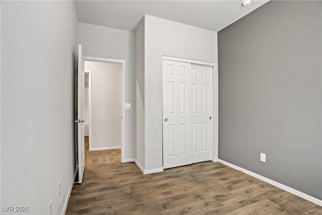 7546 Cooks Meadow St, North Las Vegas, NV 89084 - unfurnished bedroom featuring wood finished floors and a closet