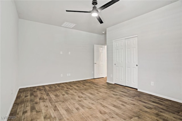 7546 Cooks Meadow St, North Las Vegas, NV 89084 - unfurnished bedroom featuring wood finished floors, a ceiling fan, and a closet
