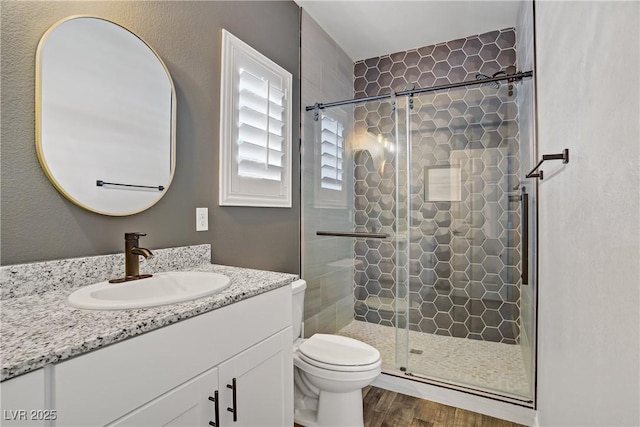 7546 Cooks Meadow St, North Las Vegas, NV 89084 - bathroom with vanity, wood finished floors, and a shower stall