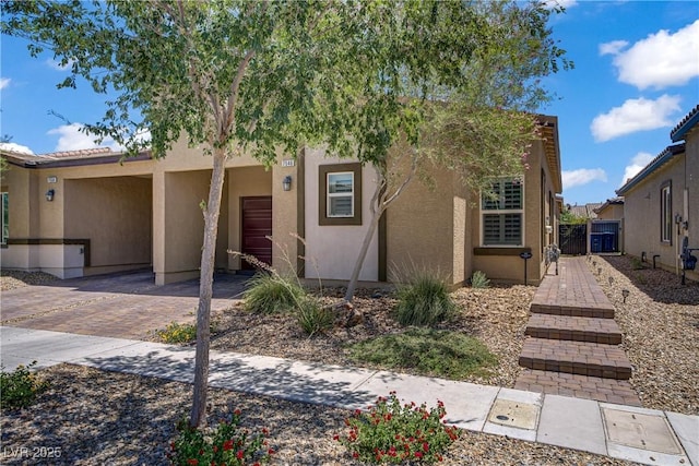 7546 Cooks Meadow St, North Las Vegas, NV 89084 - view of front facade with stucco siding and decorative driveway
