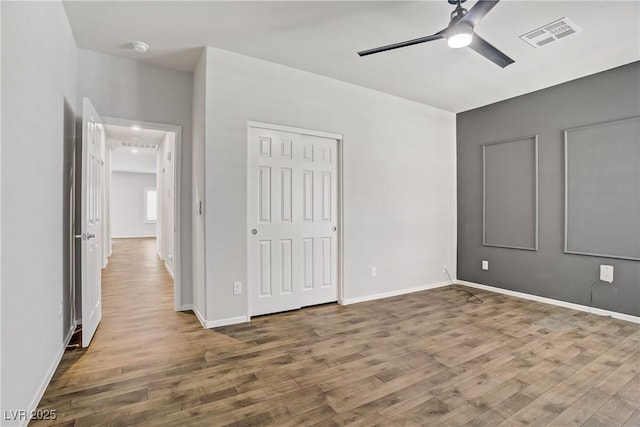 7546 Cooks Meadow St, North Las Vegas, NV 89084 - unfurnished bedroom featuring wood finished floors, a closet, and ceiling fan