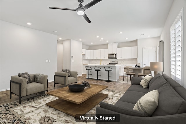 7546 Cooks Meadow St, North Las Vegas, NV 89084 - living room with ceiling fan, wood finished floors, and recessed lighting
