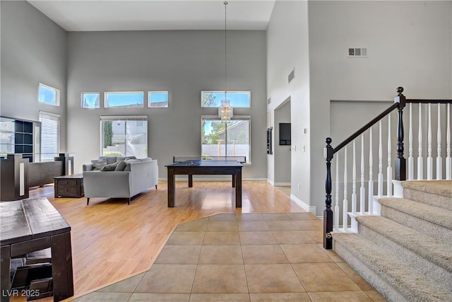 229 Wellspring Ave, Las Vegas, NV 89183 - living area with a high ceiling, stairway, wood finished floors, and pool table