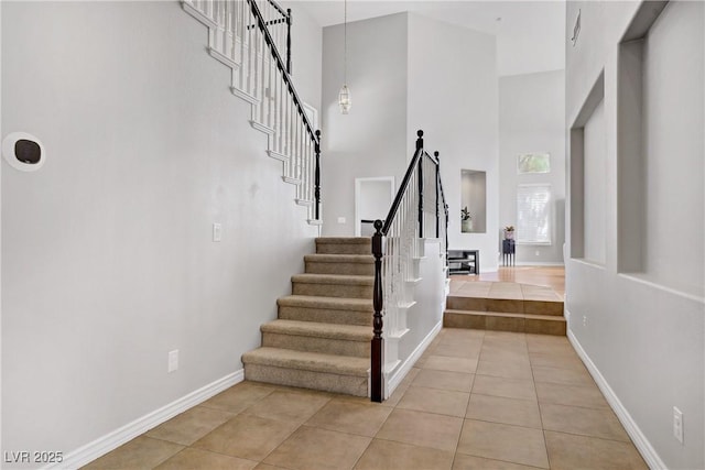 229 Wellspring Ave, Las Vegas, NV 89183 - stairs with tile patterned floors and a high ceiling