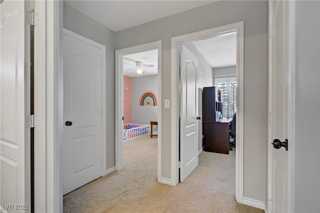 229 Wellspring Ave, Las Vegas, NV 89183 - corridor with light colored carpet and baseboards