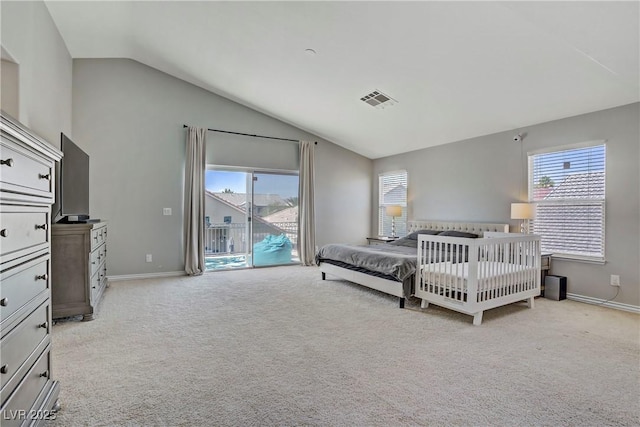 229 Wellspring Ave, Las Vegas, NV 89183 - bedroom with lofted ceiling, light carpet, multiple windows, and access to exterior