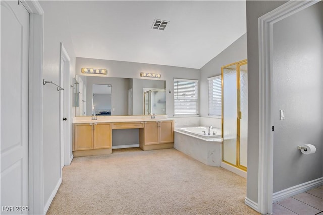 229 Wellspring Ave, Las Vegas, NV 89183 - full bath with a stall shower, vaulted ceiling, double vanity, a garden tub, and carpet floors