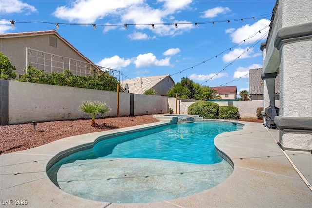 229 Wellspring Ave, Las Vegas, NV 89183 - view of swimming pool featuring a pool with connected hot tub, a fenced backyard, and a patio