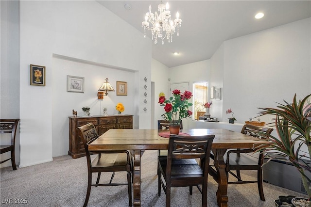 2441 Banora Point Dr, Las Vegas, NV 89134 - dining space featuring a chandelier, light colored carpet, and high vaulted ceiling