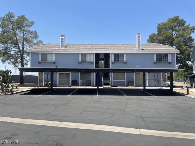 5385 Shake Ct Unit 203, Las Vegas, NV 89122 - view of building exterior with uncovered parking