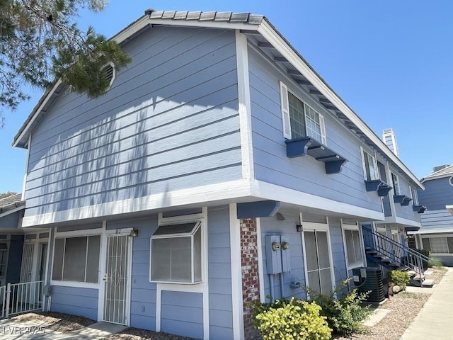 5385 Shake Ct Unit 203, Las Vegas, NV 89122 - view of side of home with a central AC unit and brick siding