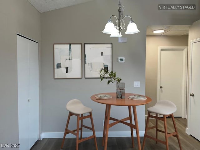 5385 Shake Ct Unit 203, Las Vegas, NV 89122 - dining space with dark wood-type flooring and a chandelier