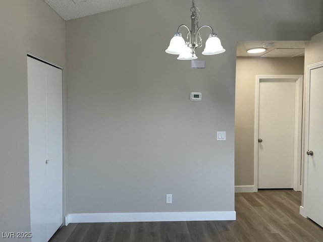 5385 Shake Ct Unit 203, Las Vegas, NV 89122 - spare room with wood finished floors and a chandelier