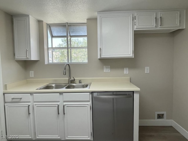 5385 Shake Ct Unit 203, Las Vegas, NV 89122 - kitchen featuring stainless steel dishwasher, light countertops, a textured ceiling, dark wood-type flooring, and white cabinets