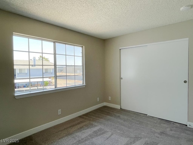 5385 Shake Ct Unit 203, Las Vegas, NV 89122 - empty room with a textured ceiling, carpet floors, and a smoke detector