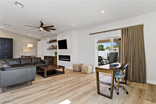 3890 Quadrel St, Las Vegas, NV 89129 - living room featuring ceiling fan, light wood finished floors, a desk, a glass covered fireplace, and recessed lighting