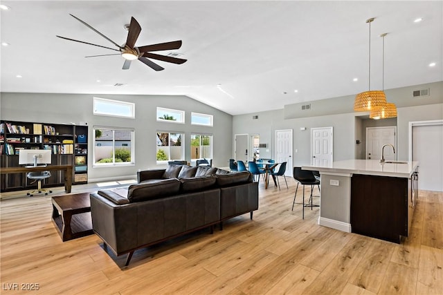 3890 Quadrel St, Las Vegas, NV 89129 - living room featuring ceiling fan, light wood-style floors, and high vaulted ceiling