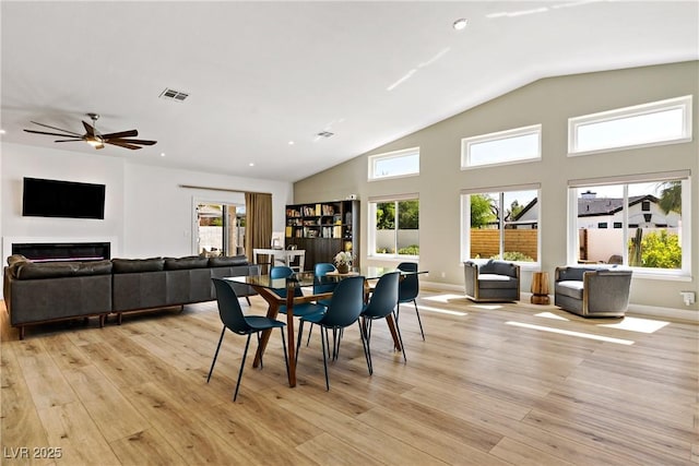 3890 Quadrel St, Las Vegas, NV 89129 - dining area with vaulted ceiling, light wood finished floors, healthy amount of natural light, ceiling fan, and recessed lighting