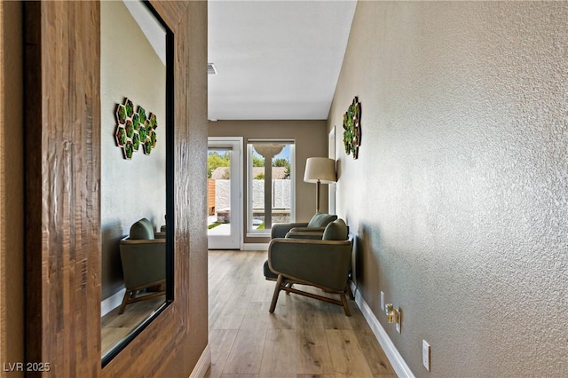 3890 Quadrel St, Las Vegas, NV 89129 - corridor featuring a textured wall and hardwood / wood-style floors