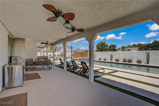 3890 Quadrel St, Las Vegas, NV 89129 - fenced backyard featuring ceiling fan, outdoor dining area, and a patio