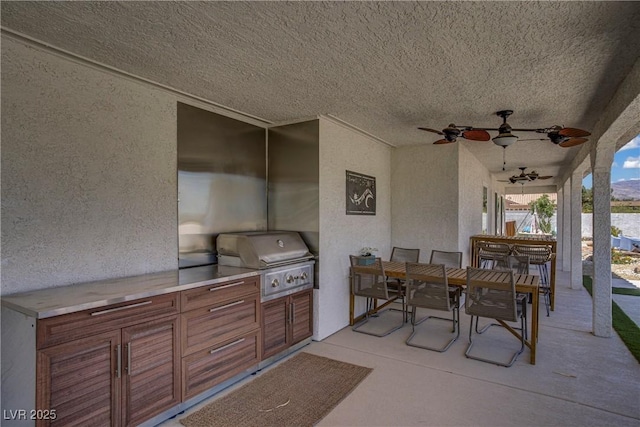3890 Quadrel St, Las Vegas, NV 89129 - view of patio featuring area for grilling, outdoor dining area, and a ceiling fan