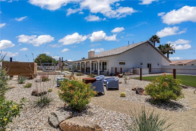 3890 Quadrel St, Las Vegas, NV 89129 - rear view of house with a chimney, a patio, and stucco siding