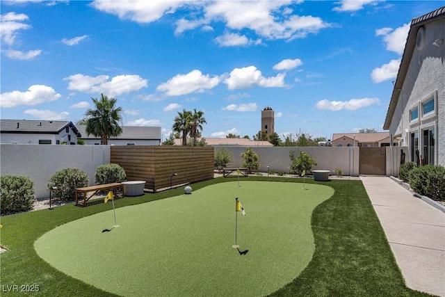 3890 Quadrel St, Las Vegas, NV 89129 - view of community with a putting area and a fenced backyard