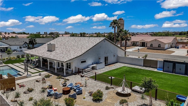 3890 Quadrel St, Las Vegas, NV 89129 - back of house with a fenced backyard, a residential view, a patio area, and stucco siding