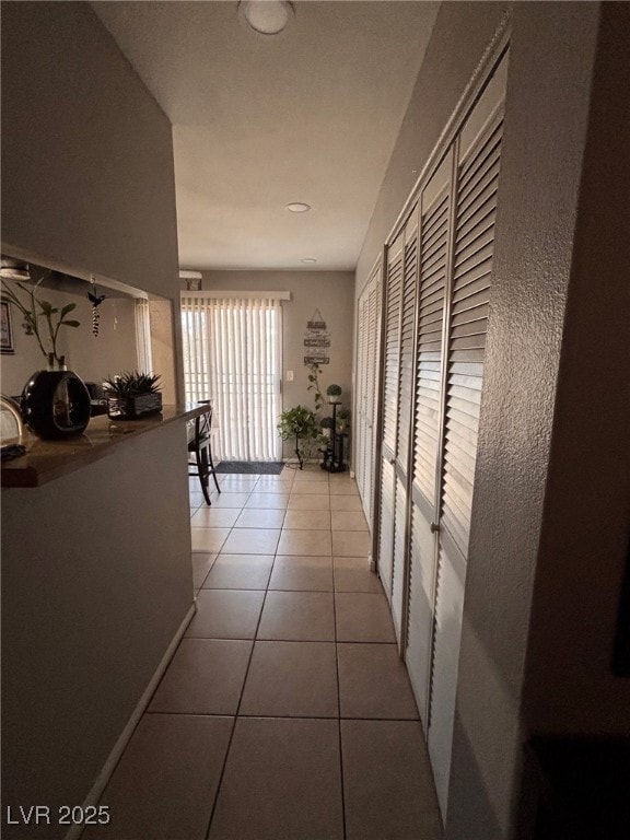 1600 N Torrey Pines Dr Unit 101, Las Vegas, NV 89108 - hall featuring light tile patterned floors