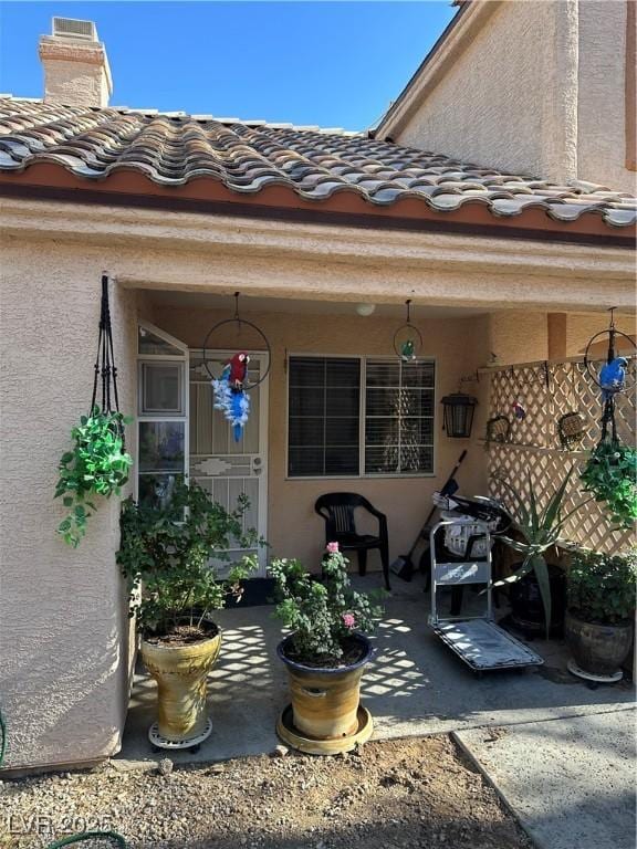 1600 N Torrey Pines Dr Unit 101, Las Vegas, NV 89108 - entrance to property featuring stucco siding and a chimney