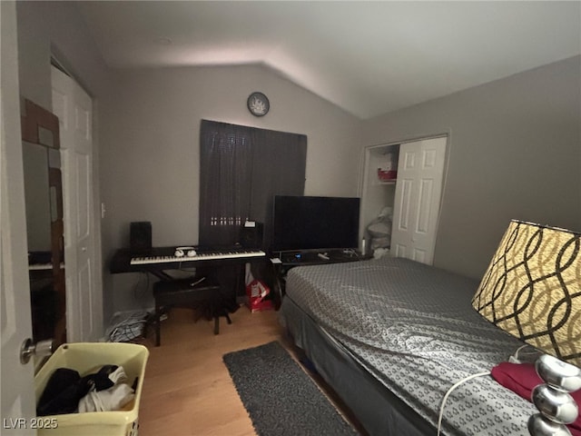 1600 N Torrey Pines Dr Unit 101, Las Vegas, NV 89108 - bedroom with wood finished floors and lofted ceiling