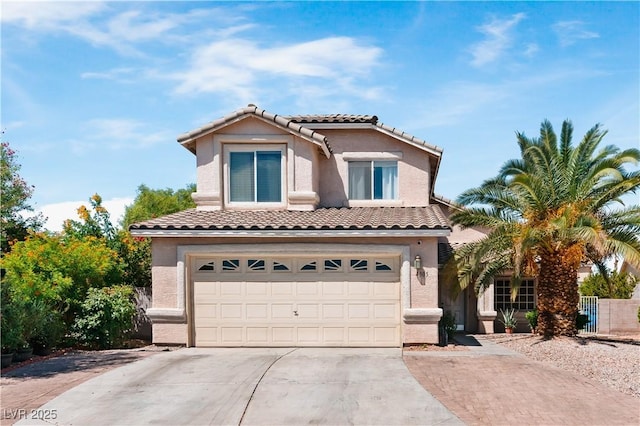4305 Threshold Ct, North Las Vegas, NV 89032 - mediterranean / spanish-style home with concrete driveway, a tile roof, an attached garage, and stucco siding