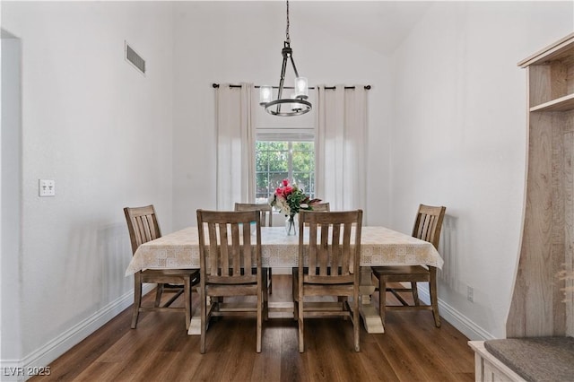 4305 Threshold Ct, North Las Vegas, NV 89032 - dining room with wood finished floors, a chandelier, and vaulted ceiling