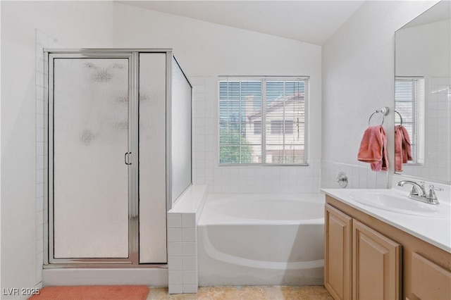 4305 Threshold Ct, North Las Vegas, NV 89032 - full bathroom with a stall shower, a garden tub, vaulted ceiling, and vanity