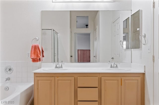 4305 Threshold Ct, North Las Vegas, NV 89032 - bathroom with double vanity, a garden tub, and a stall shower