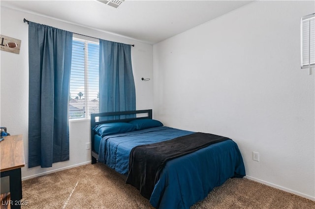 4305 Threshold Ct, North Las Vegas, NV 89032 - carpeted bedroom featuring multiple windows
