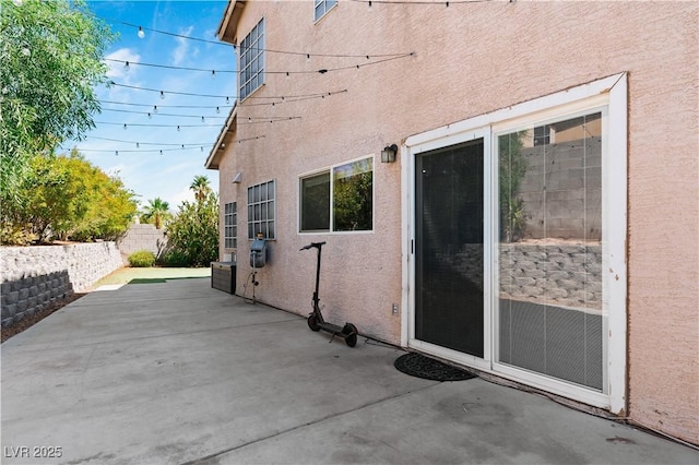 4305 Threshold Ct, North Las Vegas, NV 89032 - view of side of property with stucco siding and a patio area