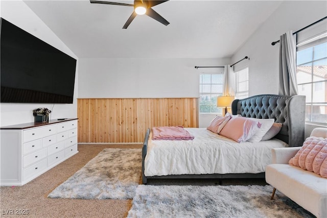4305 Threshold Ct, North Las Vegas, NV 89032 - bedroom featuring multiple windows, wood walls, wainscoting, carpet, and a ceiling fan