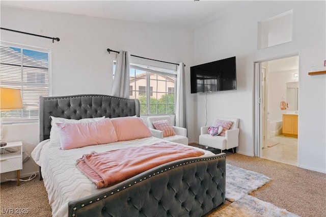 4305 Threshold Ct, North Las Vegas, NV 89032 - carpeted bedroom with connected bathroom and baseboards