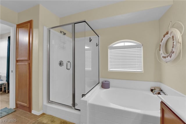 4650 Ranch House Rd Unit 64, North Las Vegas, NV 89031 - bathroom with a stall shower, a bath, tile patterned flooring, and vanity