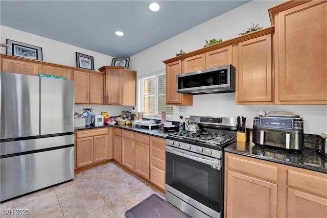 4650 Ranch House Rd Unit 64, North Las Vegas, NV 89031 - kitchen featuring stainless steel appliances, dark stone counters, light tile patterned flooring, recessed lighting, and light brown cabinetry