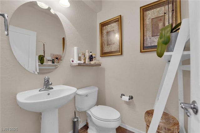 4650 Ranch House Rd Unit 64, North Las Vegas, NV 89031 - bathroom featuring toilet and baseboards